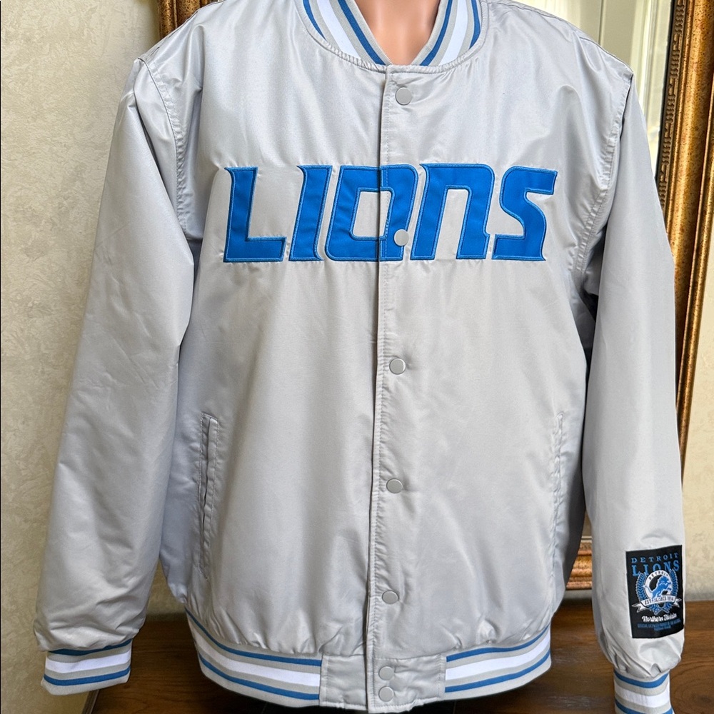 Detroit Lions varsity jacket Sz XL. Blue letters on front, Lion emblem on back.